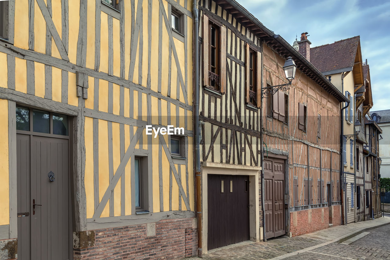 Street with historical half-timbered houses in troyes, france