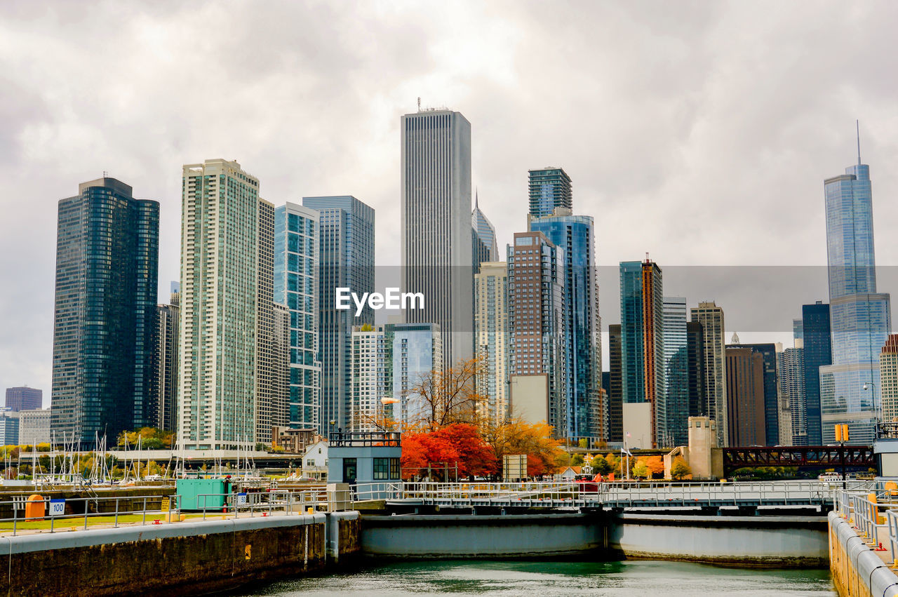 Cityscape against cloudy sky