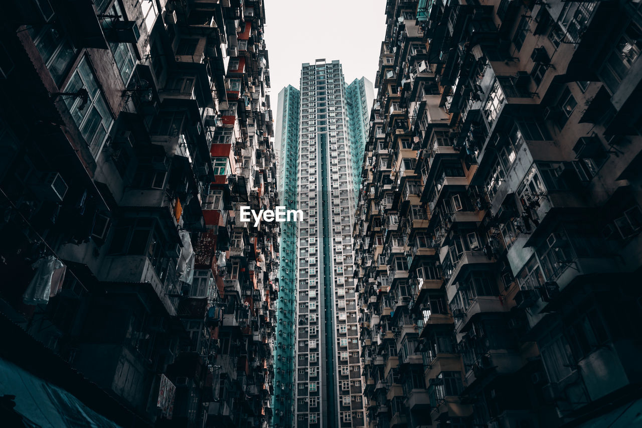 Low angle view of buildings in city against sky