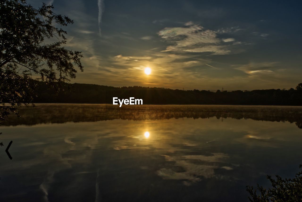 SCENIC VIEW OF SUNSET OVER LAKE