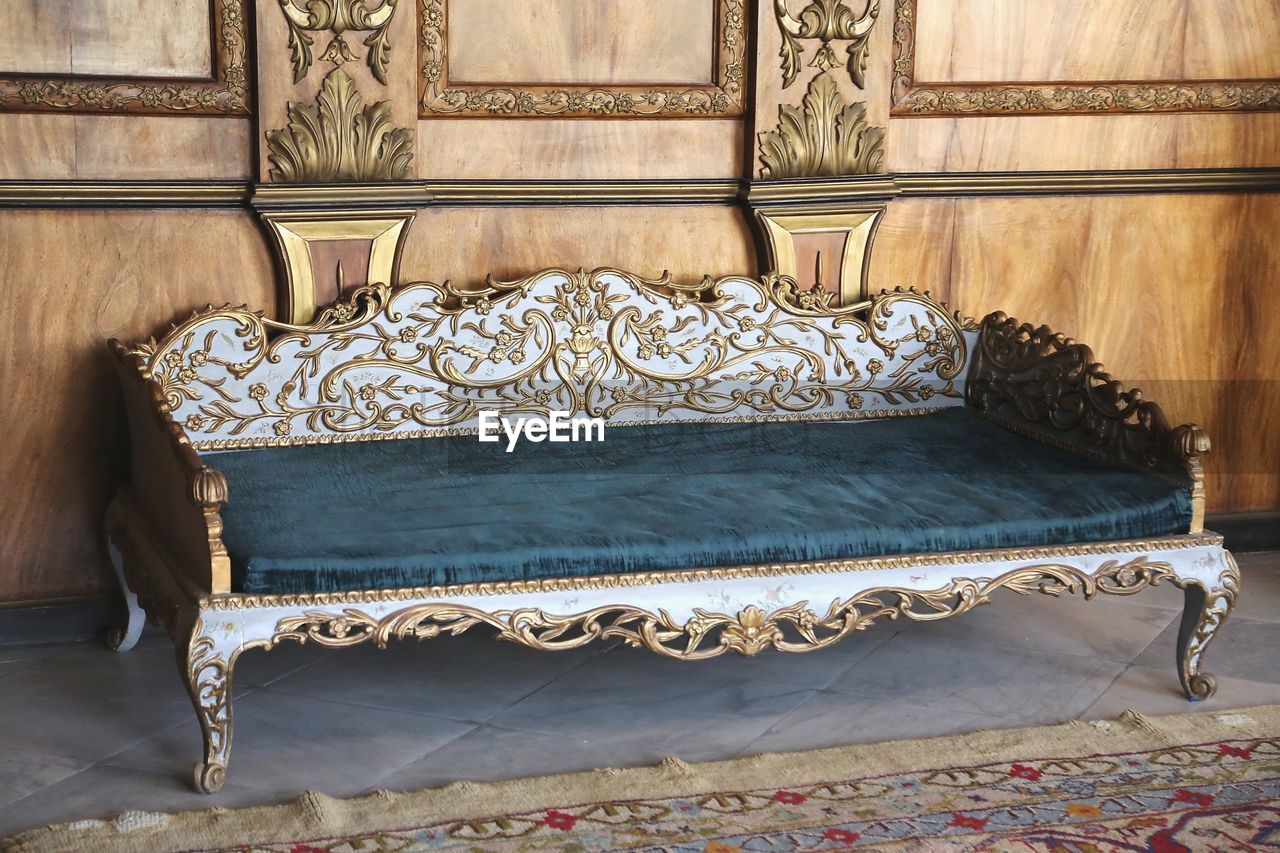 CLOSE-UP OF ORNATE BED