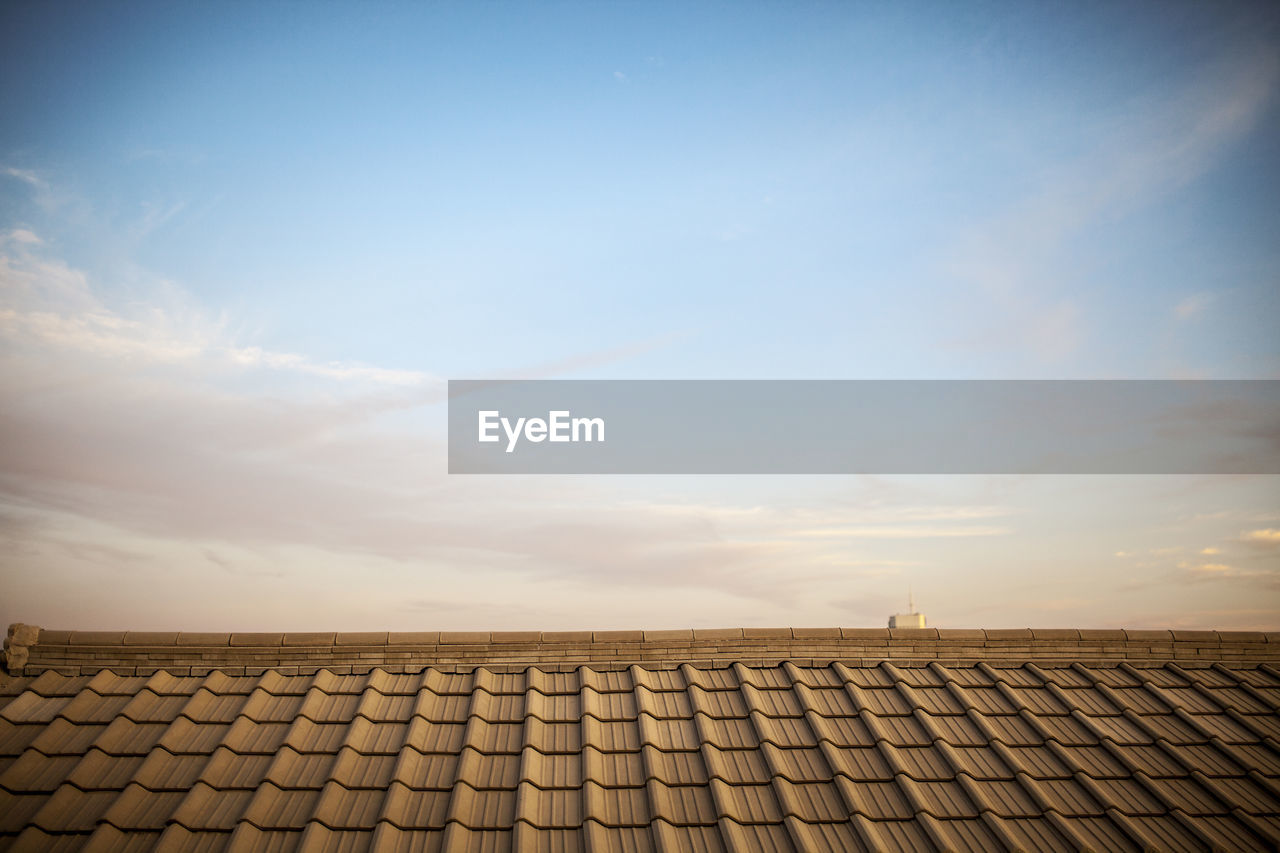 Low angle view of roof and building against sky