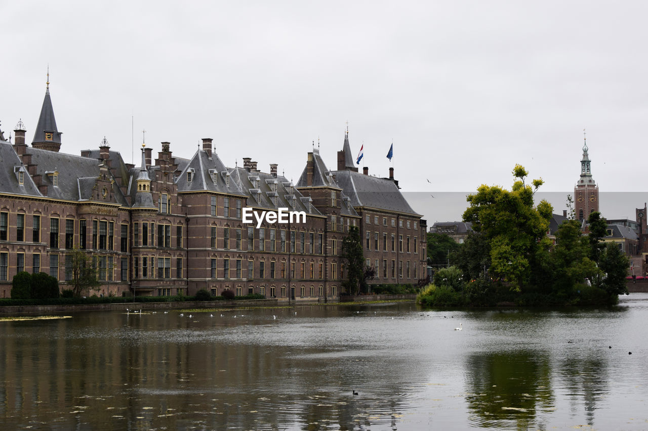 VIEW OF BUILDINGS BY RIVER