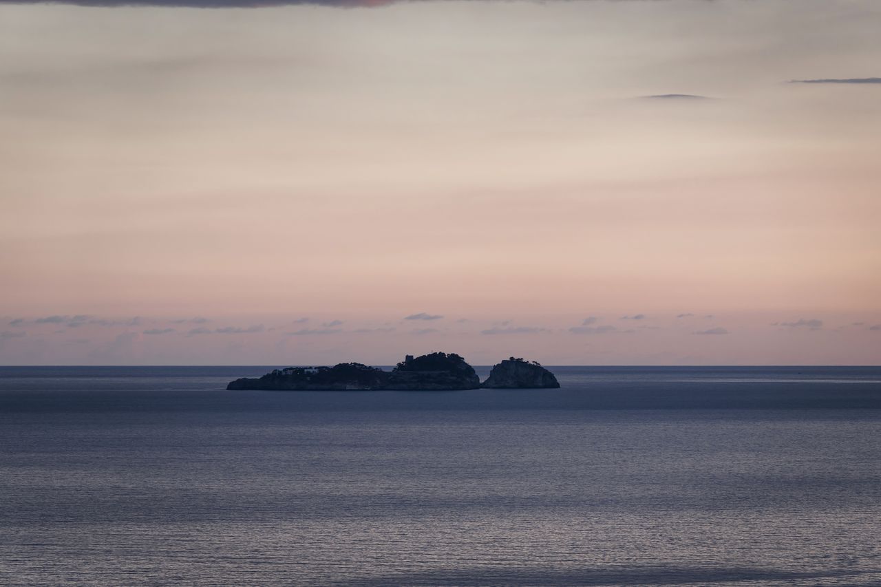 SCENIC VIEW OF SEA AGAINST ORANGE SKY