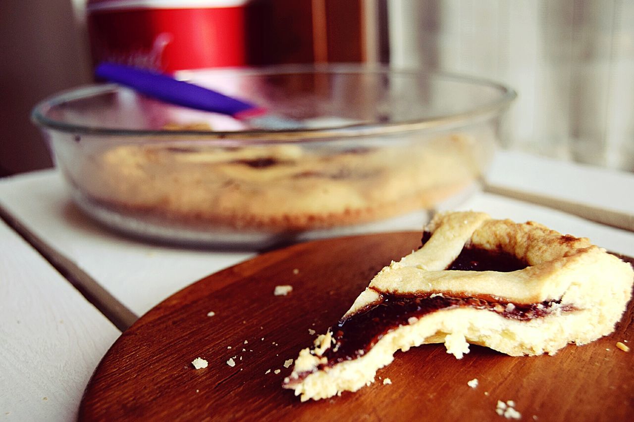 Close-up of dessert on cutting board over table