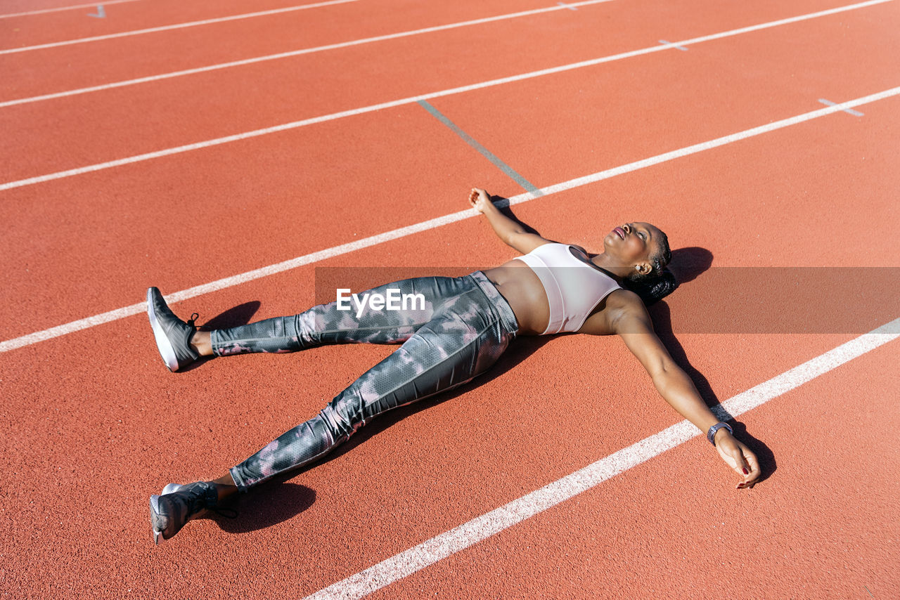 FULL LENGTH OF A MAN RUNNING ON FLOOR