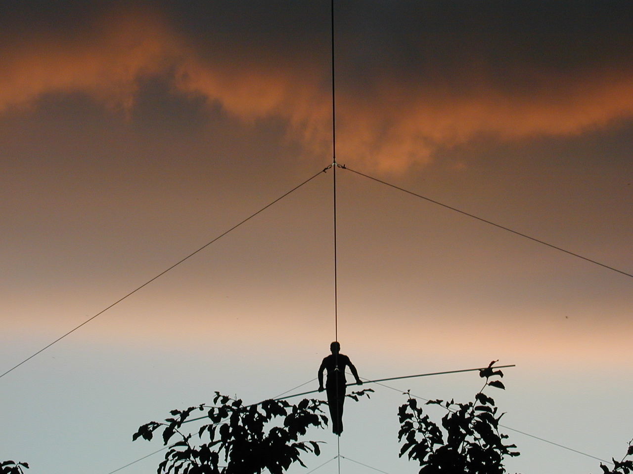 Low angle view of silhouette man against clear sky