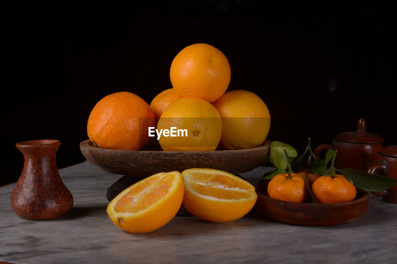 CLOSE-UP OF FRUITS ON TABLE