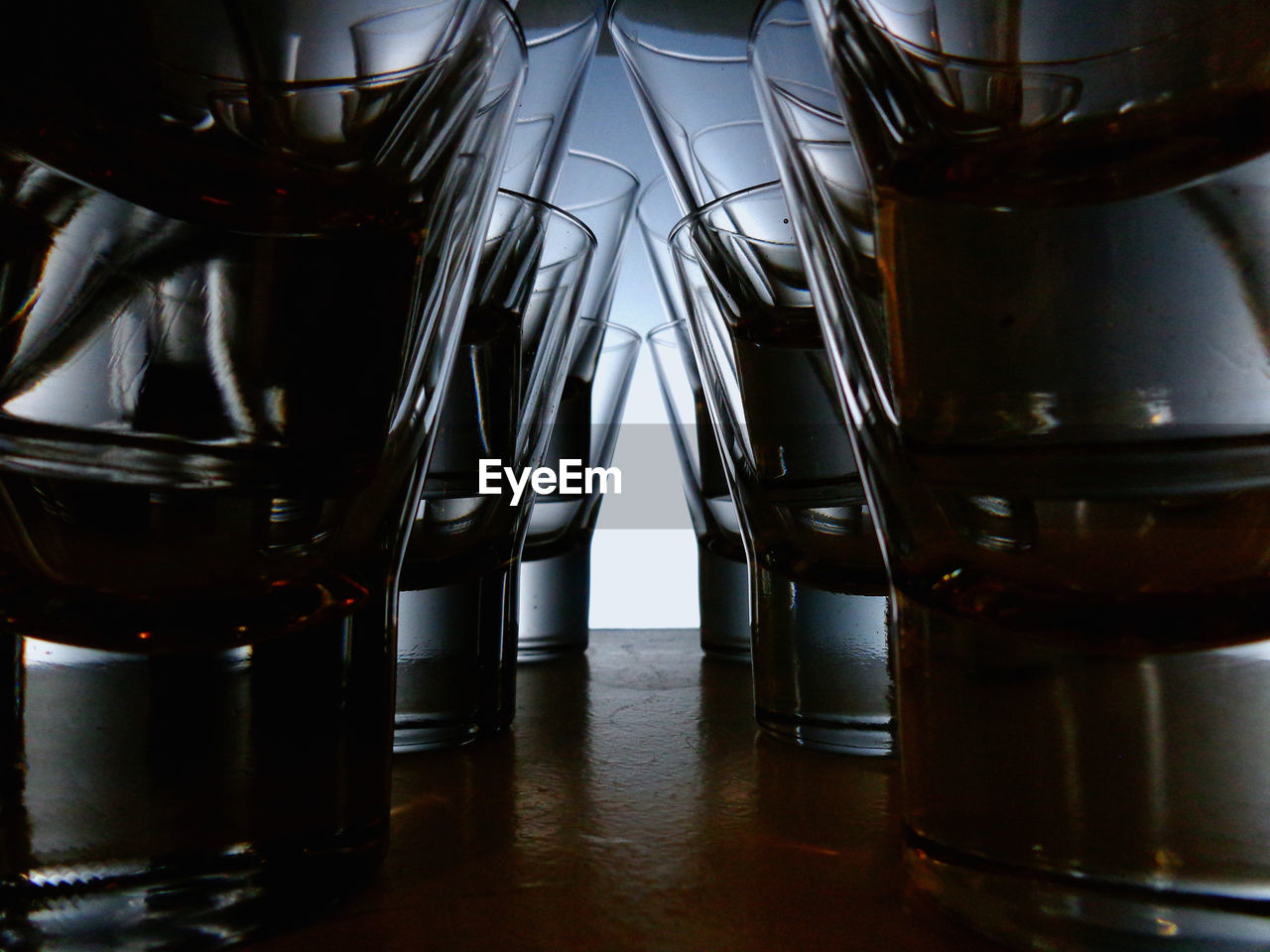 Close-up of drinking glasses on table