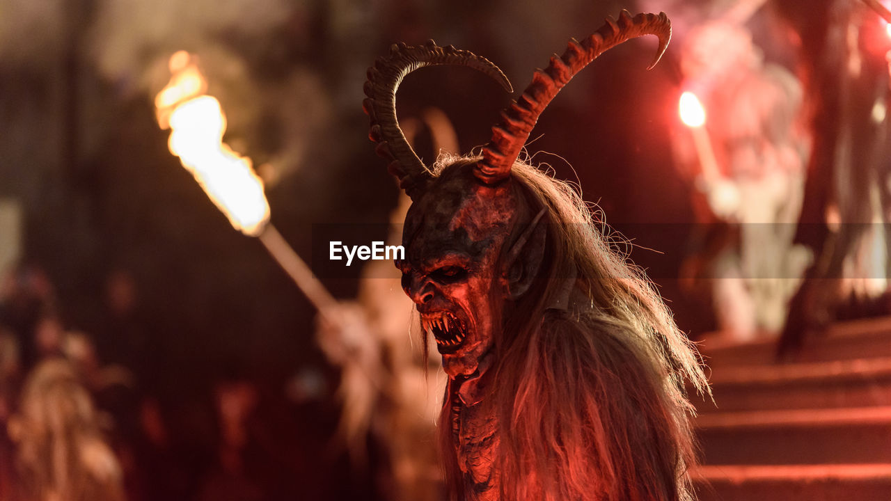 Man wearing spooky costume during halloween at night