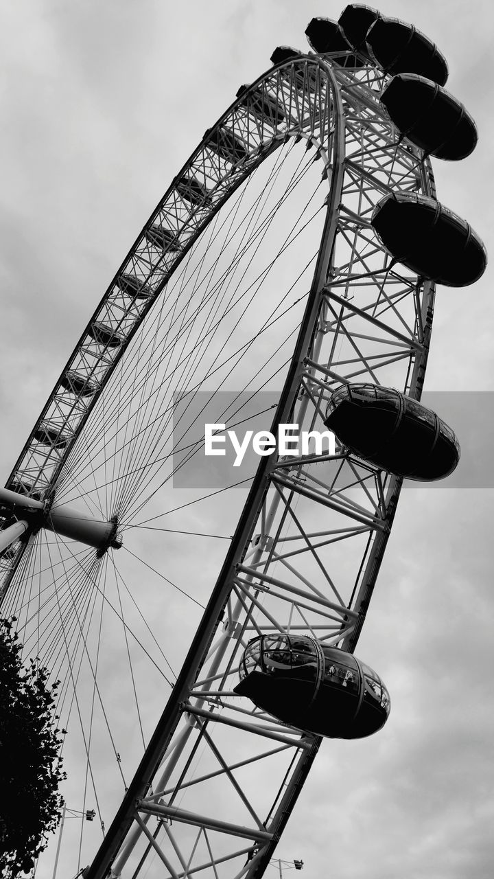 Low angle view of ferris wheel against sky