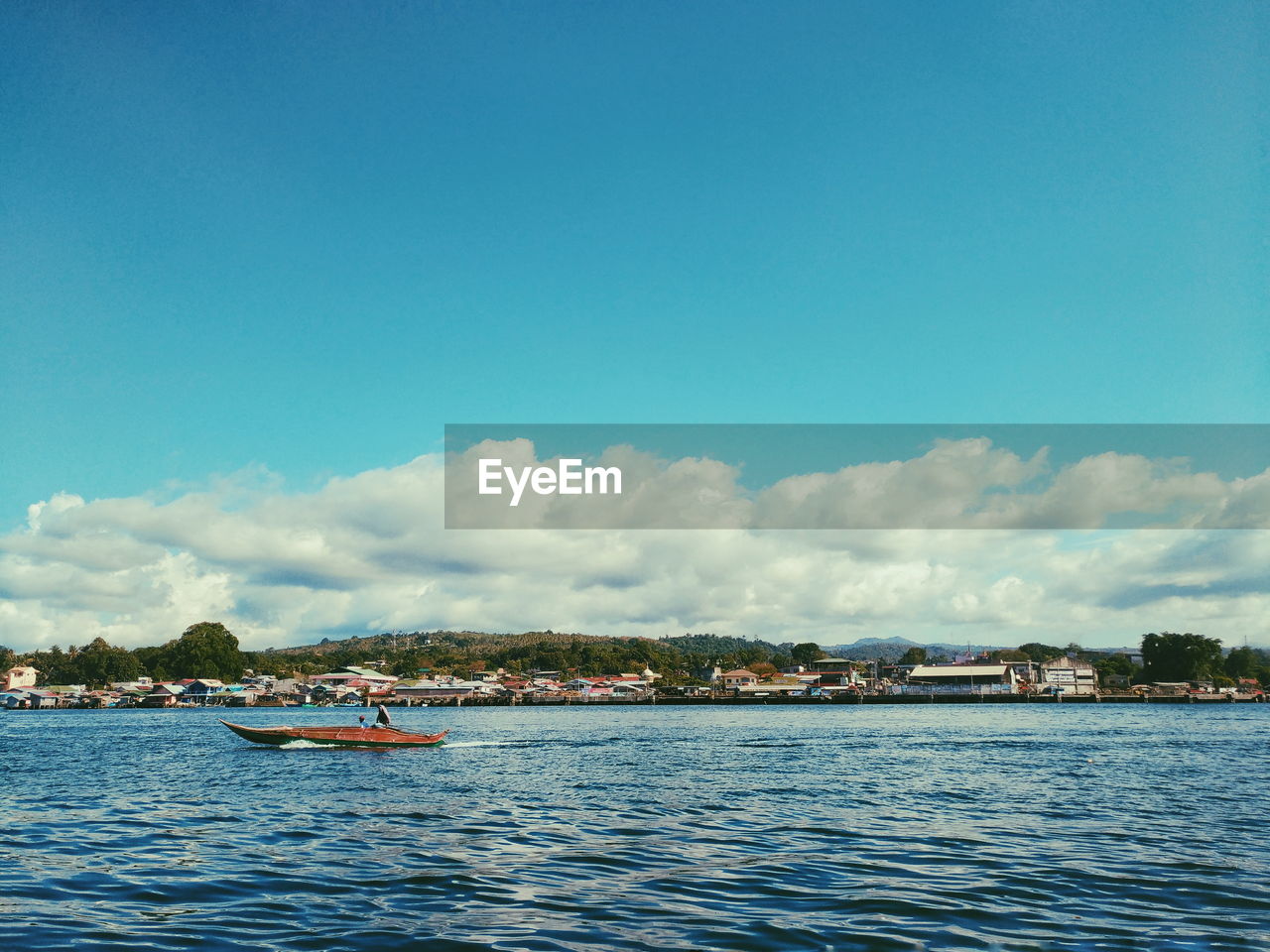 Scenic view of seascape against blue sky