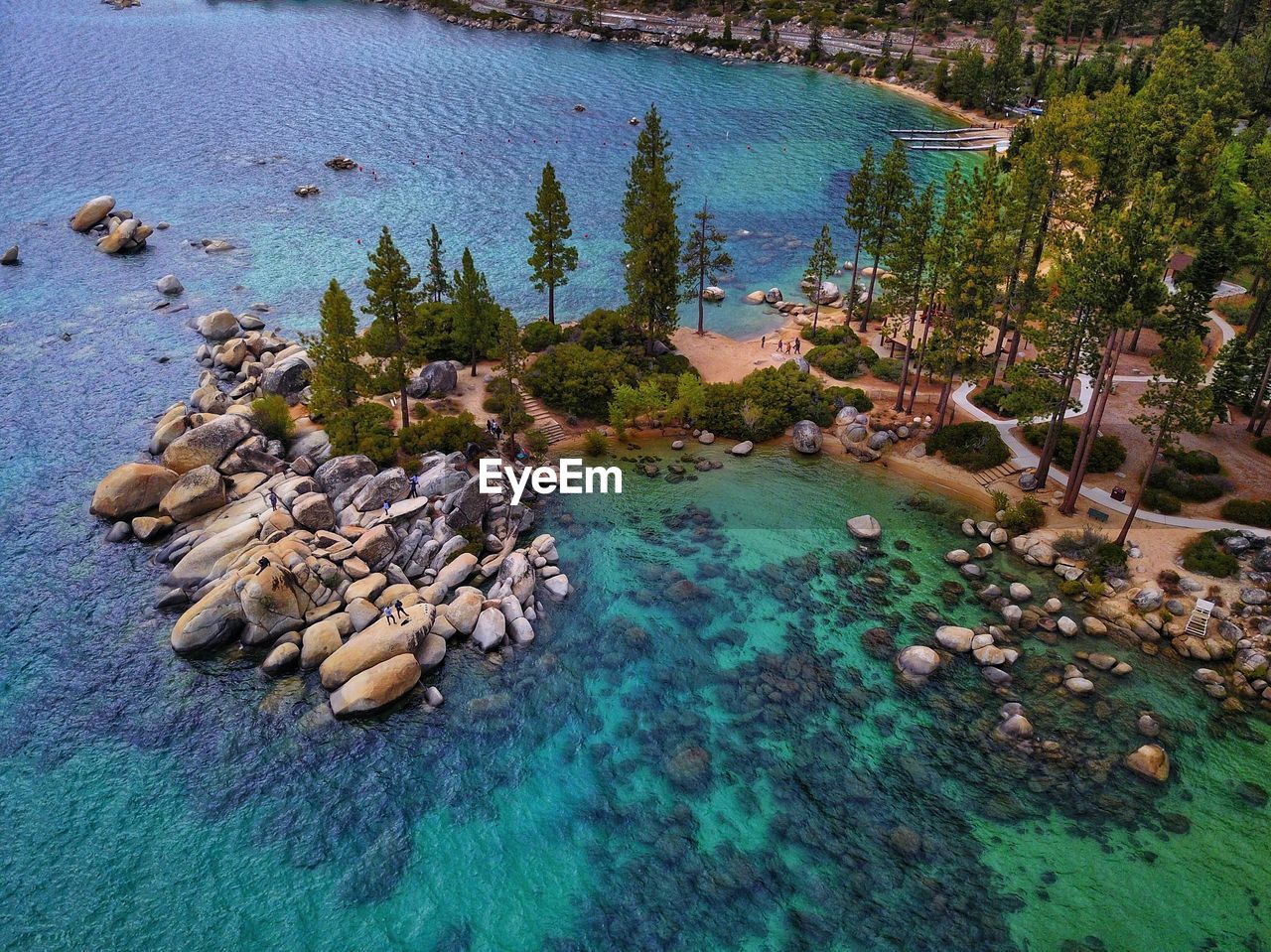 HIGH ANGLE VIEW OF SWIMMING POOL AT SHORE