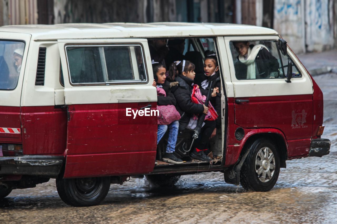 Schoolboy's cram into a minibus for ride home in the jabalya refugee camp.