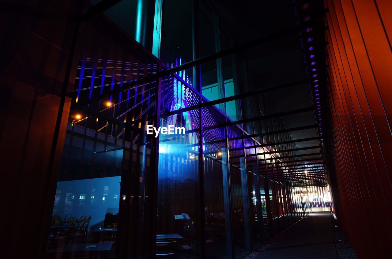 Low angle view of illuminated walkway at night