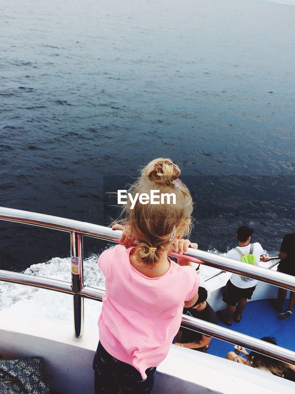 Rear view of girl looking at sea