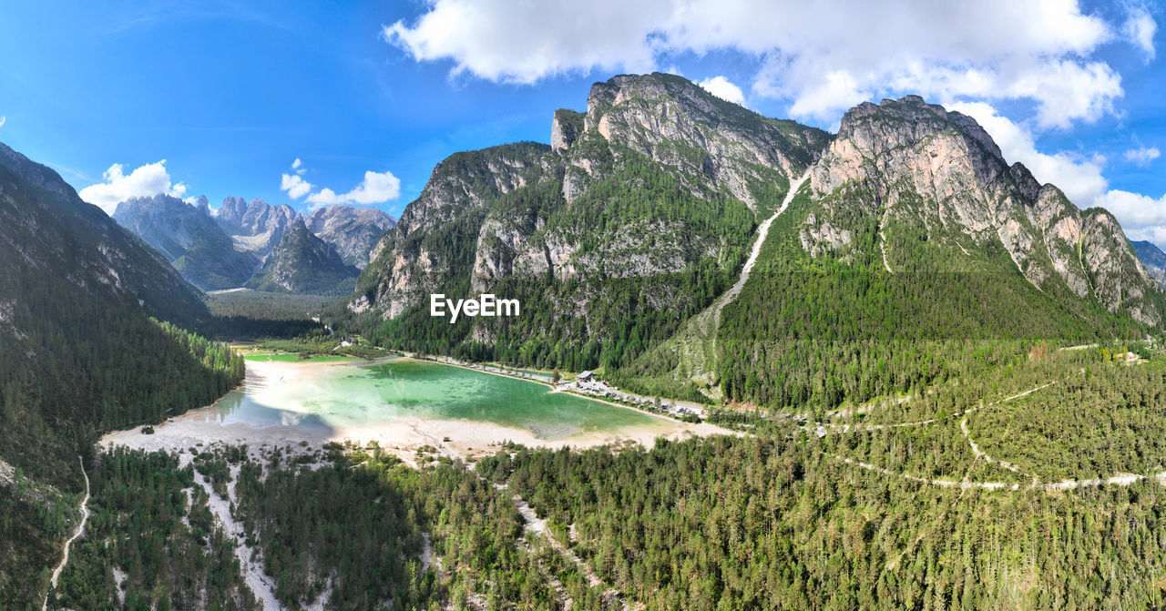 mountain, scenics - nature, environment, landscape, mountain range, sky, beauty in nature, cloud, nature, panoramic, land, water, travel destinations, plant, travel, mountain pass, mountain peak, forest, hiking, blue, tranquility, tree, tranquil scene, snow, tourism, pine tree, outdoors, valley, activity, plateau, non-urban scene, environmental conservation, pine woodland, green, cold temperature, pinaceae, social issues, rock, coniferous tree, lake, grass, summer, wilderness, day, idyllic, leisure activity, adventure, vacation, trip, holiday, ridge, glacier, sunlight, winter, rural scene