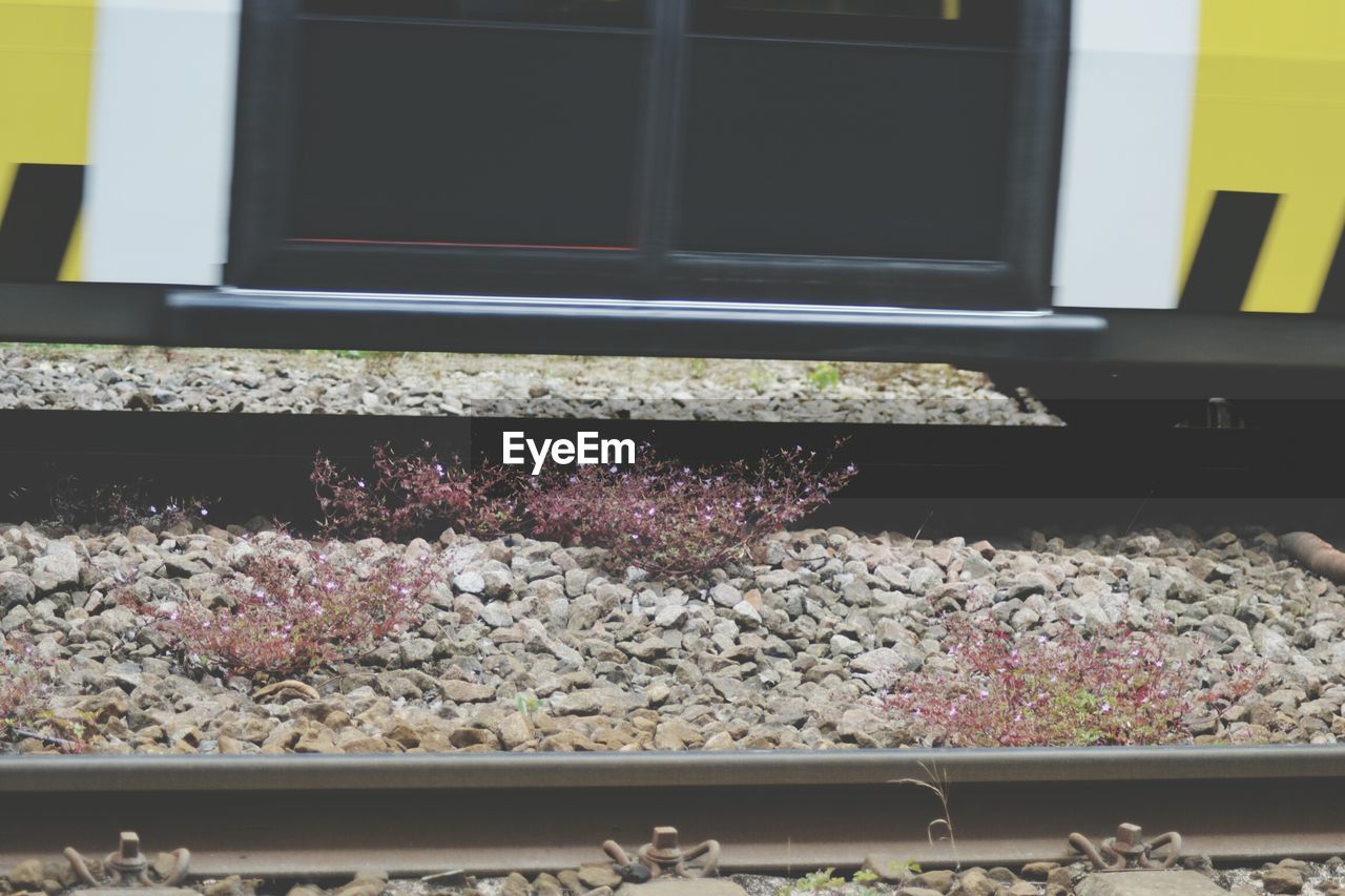 Close-up of cable car on railroad track