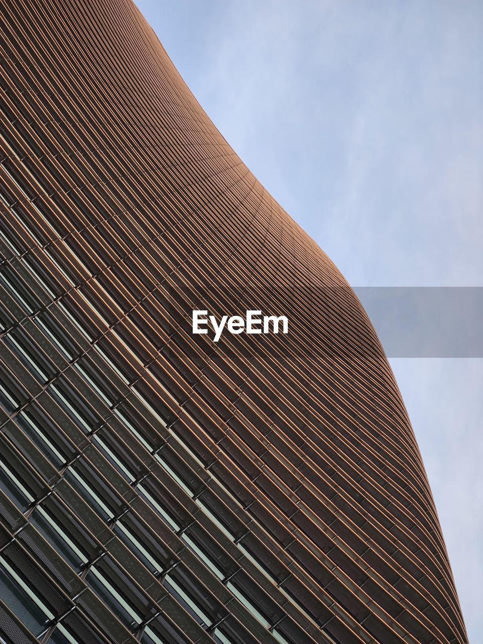 LOW ANGLE VIEW OF ROOF AGAINST BUILDING