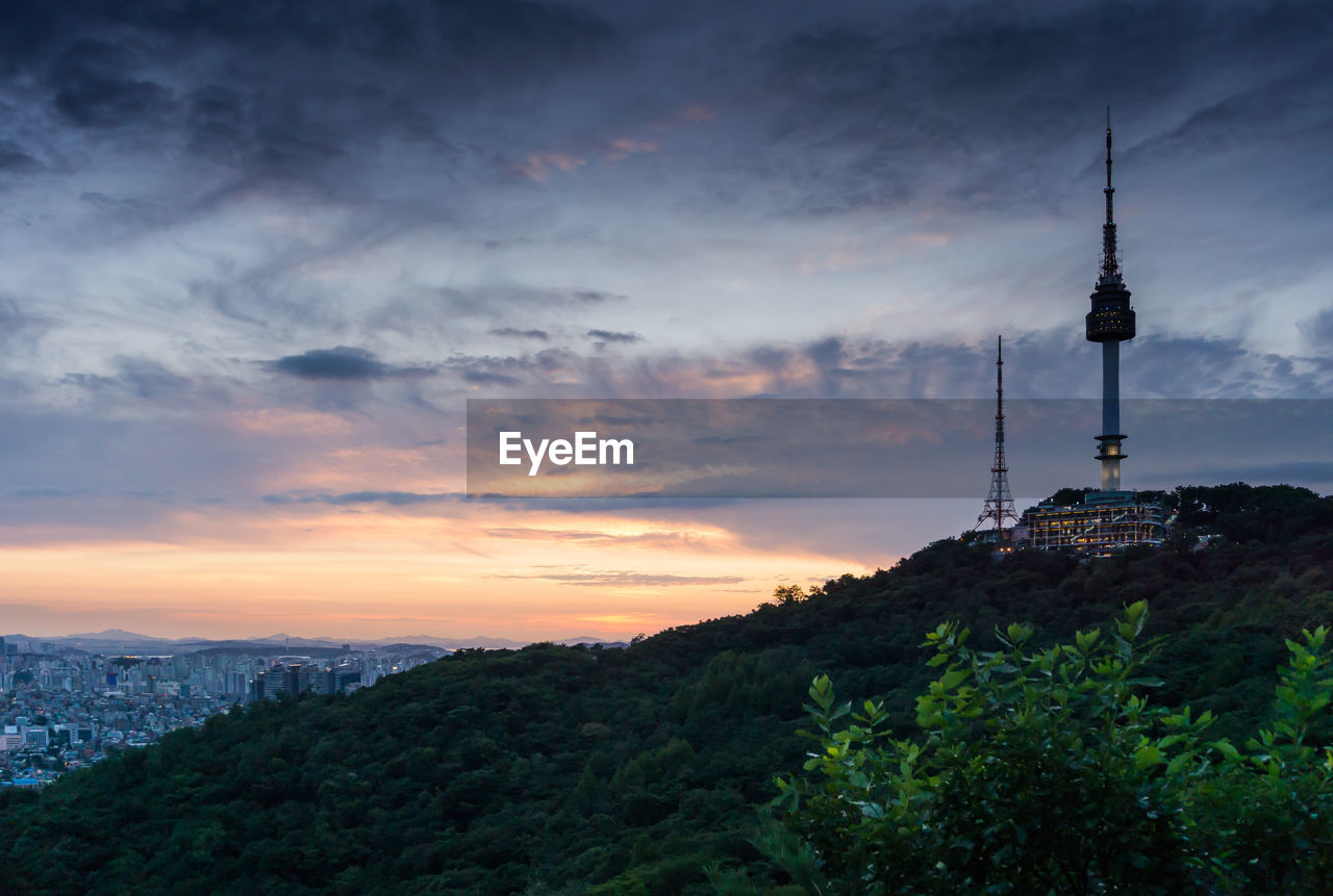 COMMUNICATIONS TOWER AGAINST SKY AT SUNSET