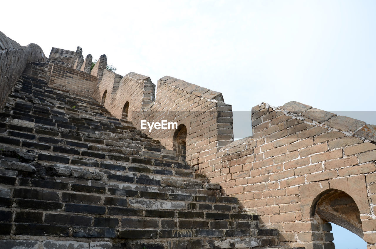 Low angle view of old ruins against clear sky