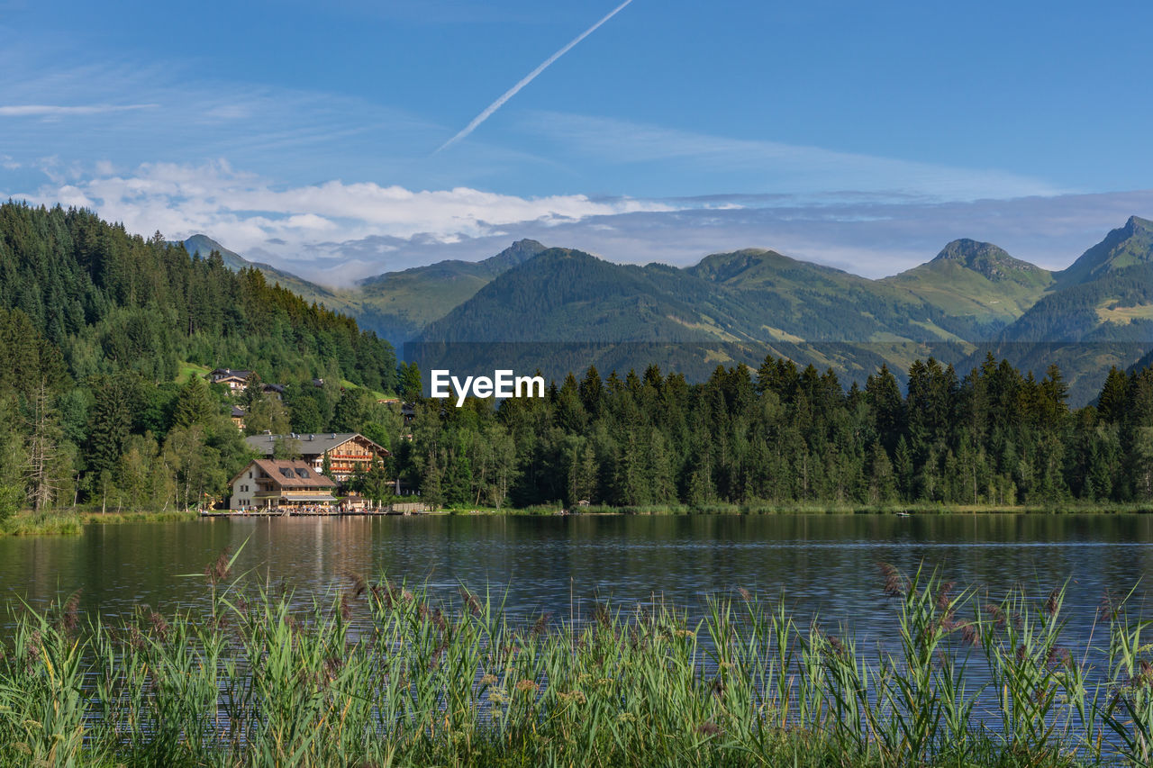 Scenic view of lake and mountains against sky