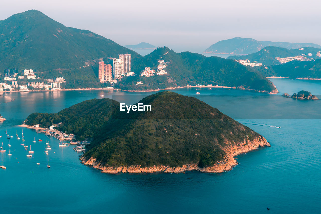 View of boats middle islands buildings in seaside at deep water bay hong kong seen form brick hill