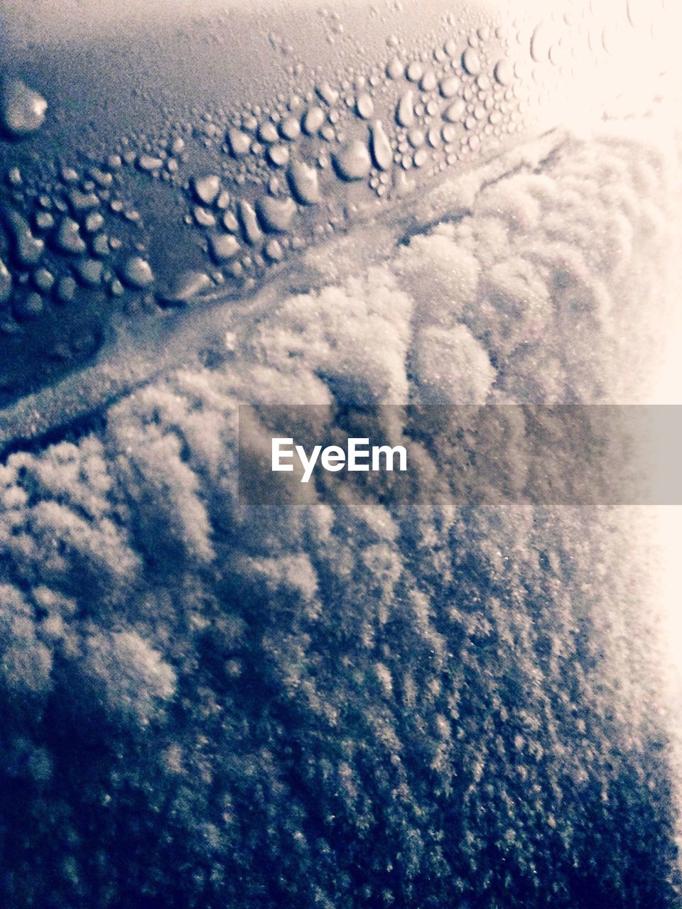 SCENIC VIEW OF CLOUDSCAPE SEEN THROUGH AIRPLANE