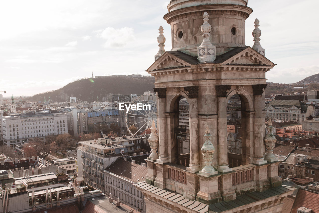 Elevated views of budapest and ferris wheel and several city buildings