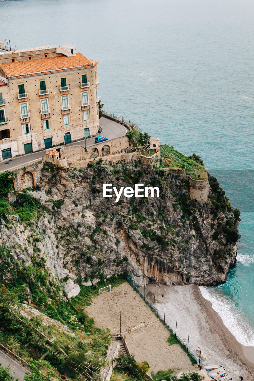 High angle view of rock formations in sea