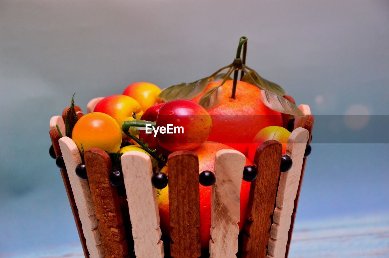 Close-up of apples in water against sky