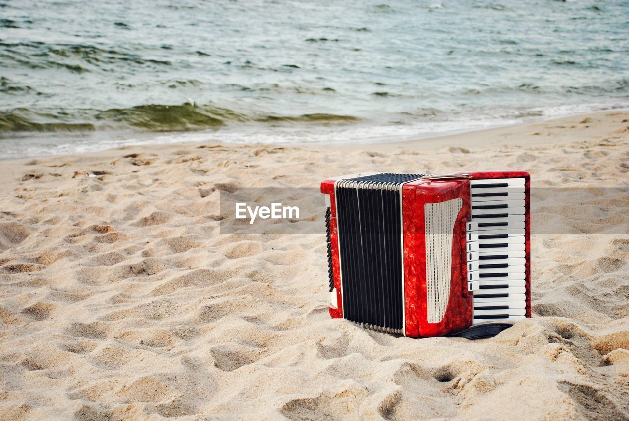 RED DECK CHAIRS ON BEACH