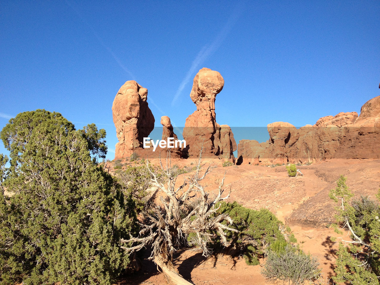 Low angle view of rock formations against blue sky