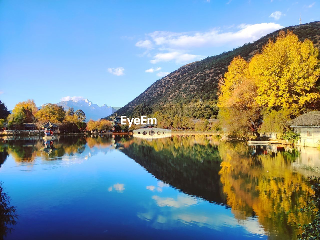 Scenic view of lake against sky during autumn