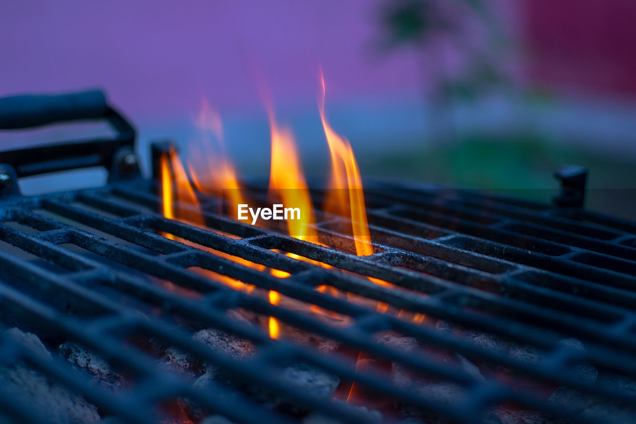Close-up of fire in barbecue grill
