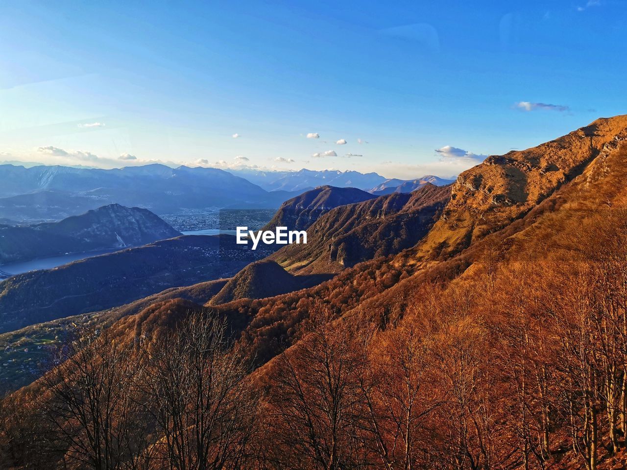 scenic view of mountains against blue sky