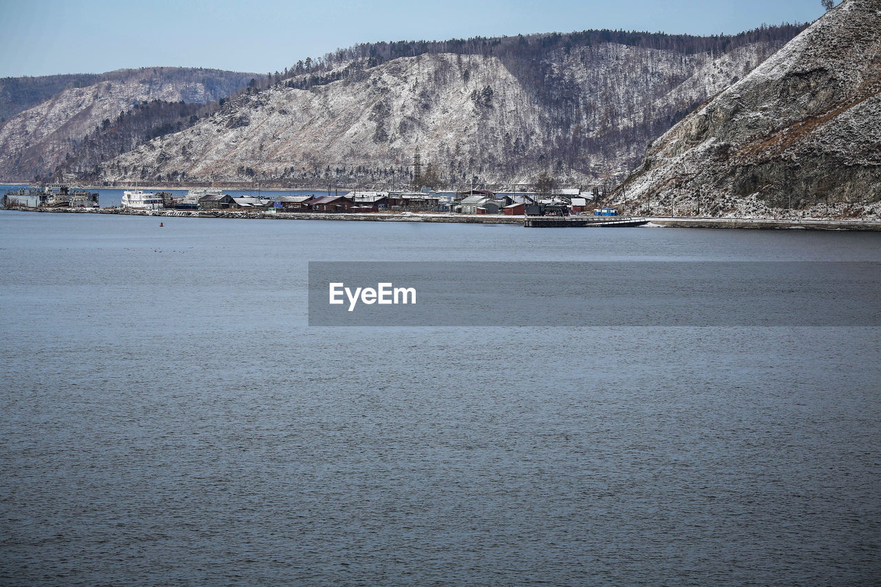 Scenic view of lake baikal against mountains