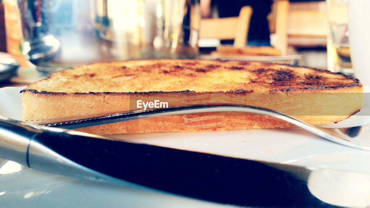 Close-up of served roasted bread in plate