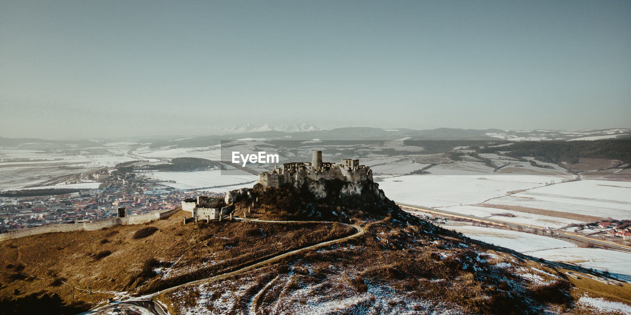 SCENIC VIEW OF SNOWCAPPED MOUNTAINS AGAINST CLEAR SKY