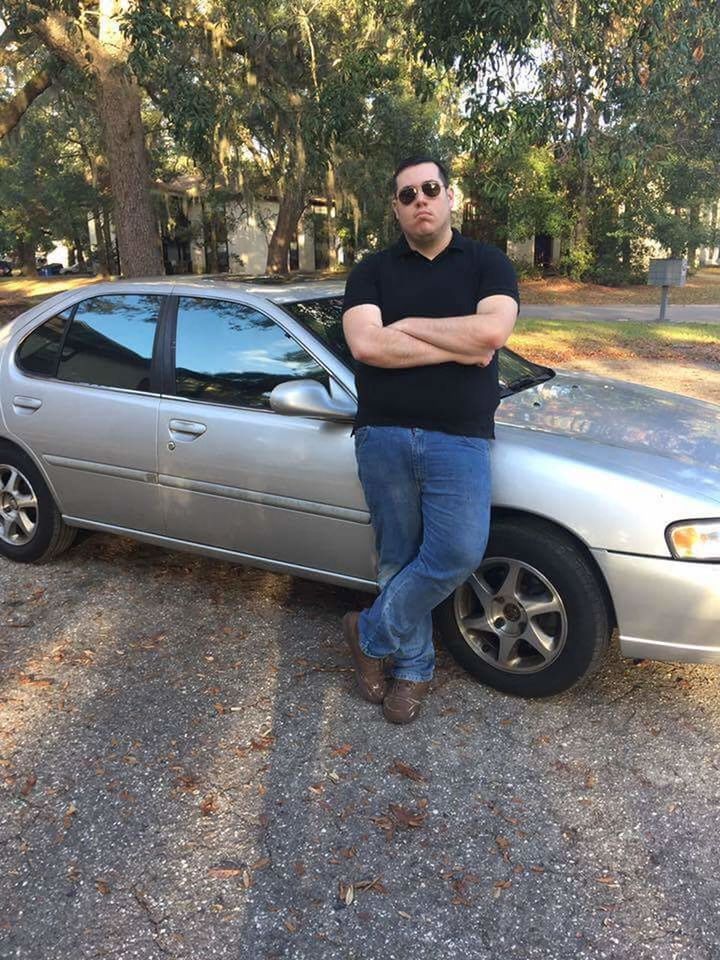 FULL LENGTH PORTRAIT OF WOMAN IN CAR