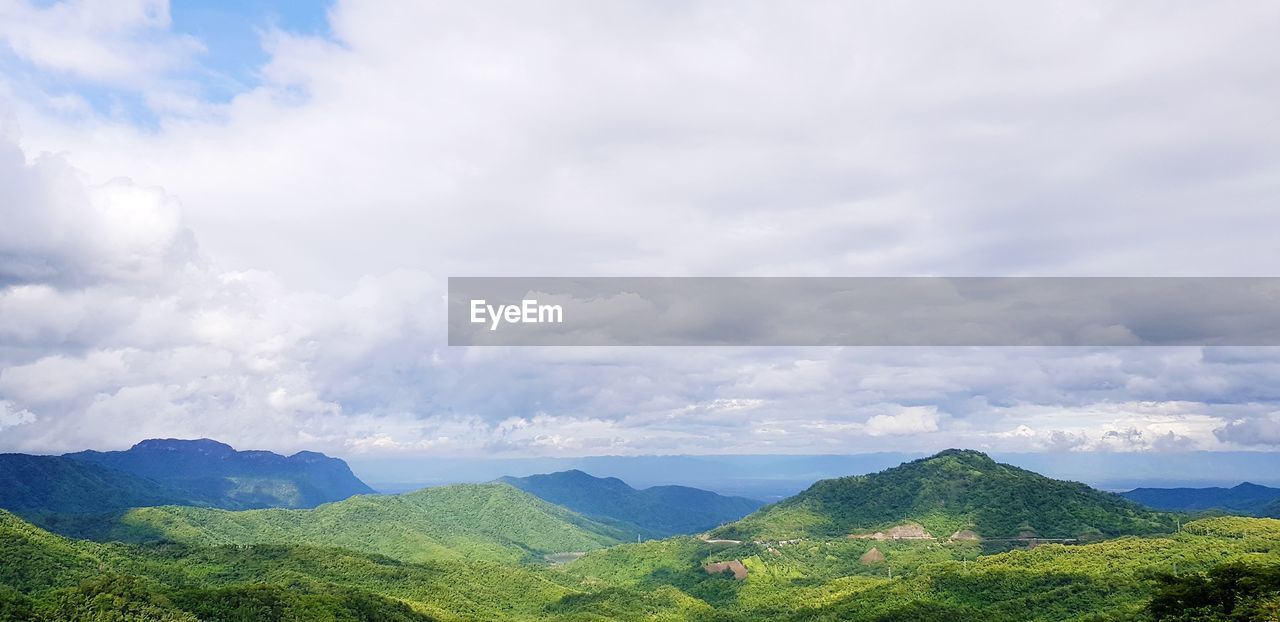 SCENIC VIEW OF GREEN LANDSCAPE AGAINST SKY