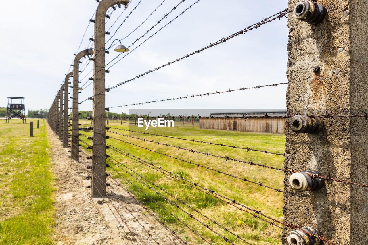 Barbed wire around the auschwitz-birkenau concentration camp. oswiecim, poland, 16 may 2022