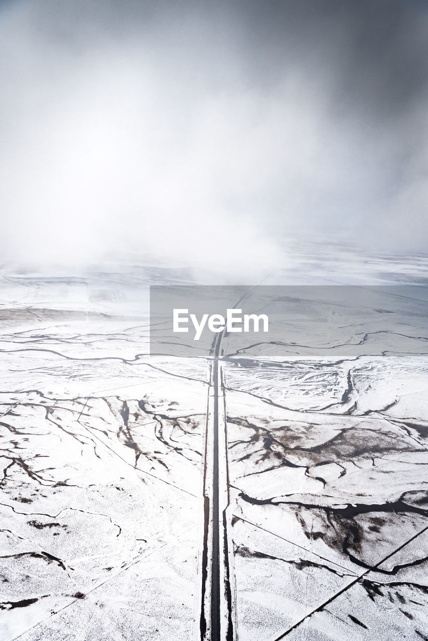 Scenic view of sea against sky during winter