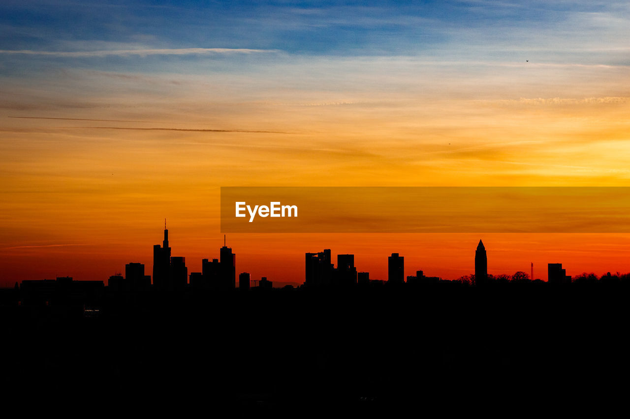 Silhouette of buildings at sunset