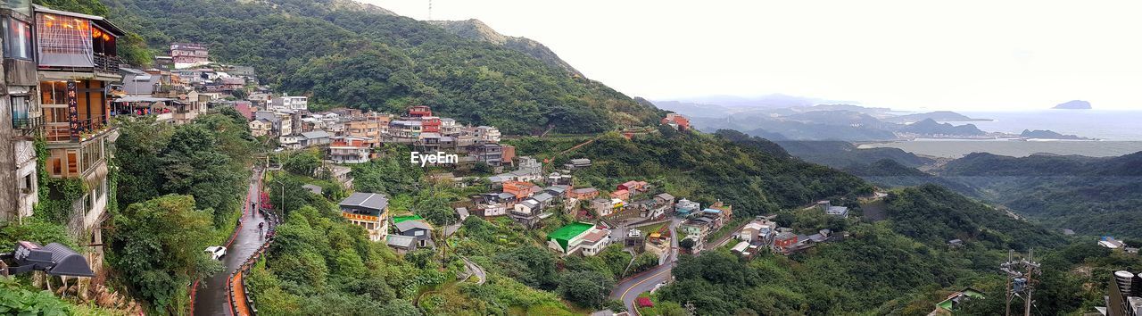 PANORAMIC VIEW OF TOWNSCAPE AND MOUNTAINS