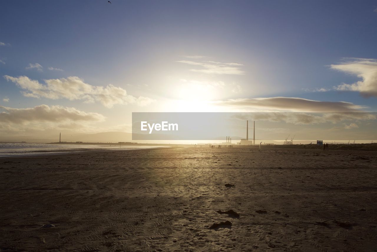 Scenic view of beach against sky during sunset