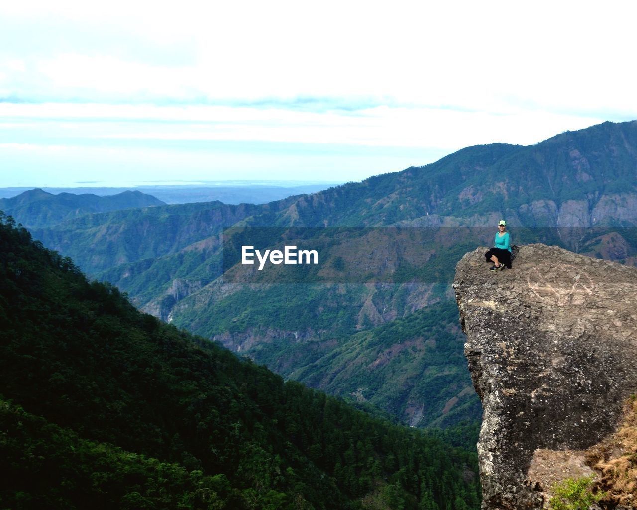 REAR VIEW OF A MAN ON MOUNTAIN