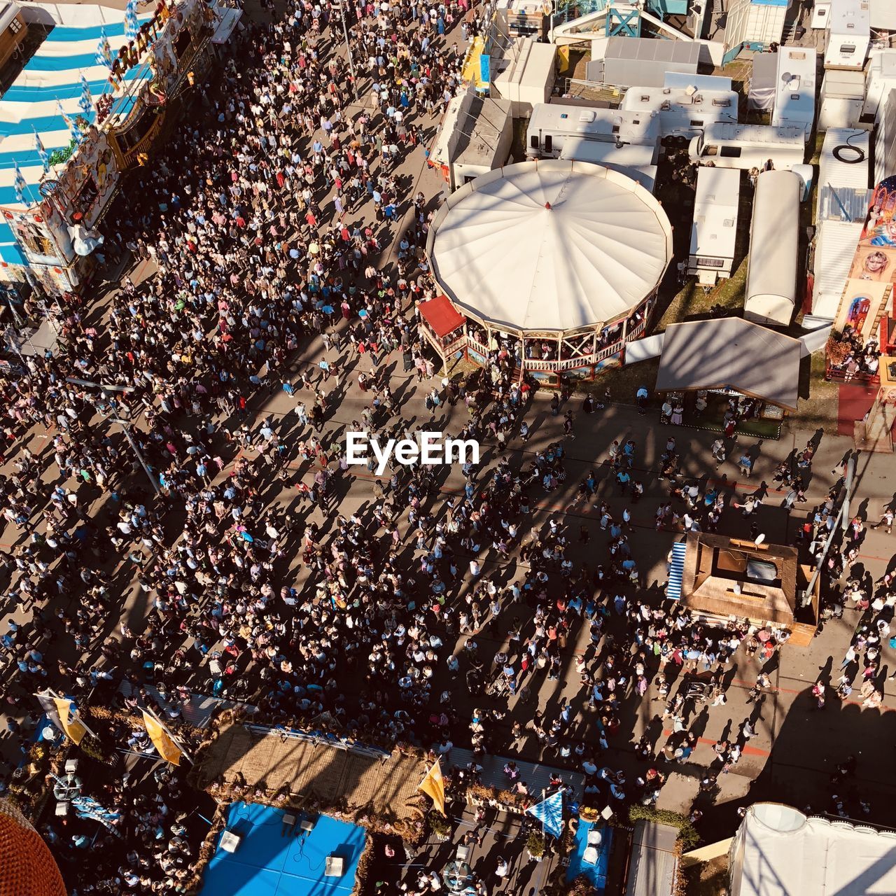 HIGH ANGLE VIEW OF PEOPLE AT MARKET STALL