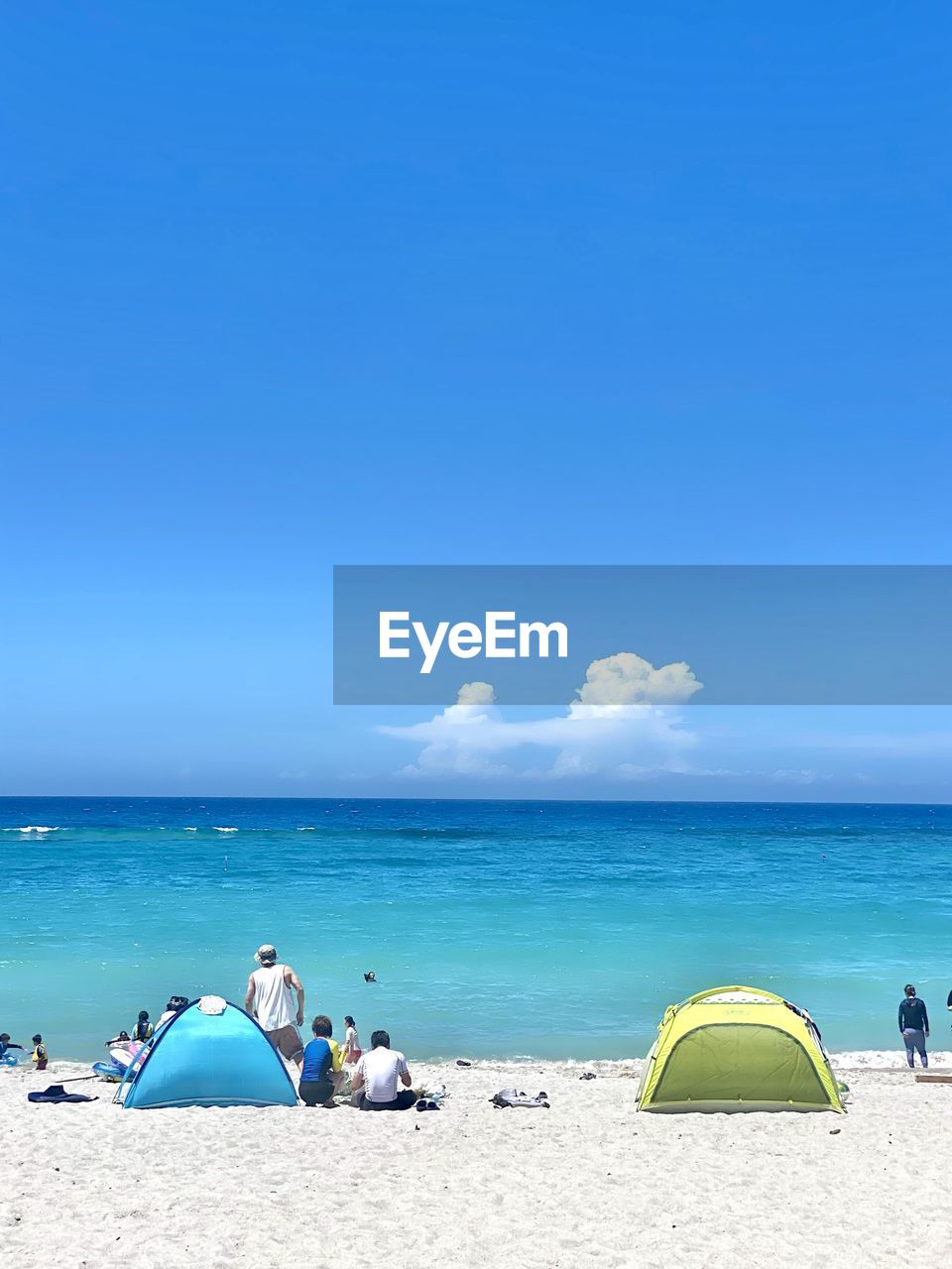 Scenic view of beach  camping against blue sky