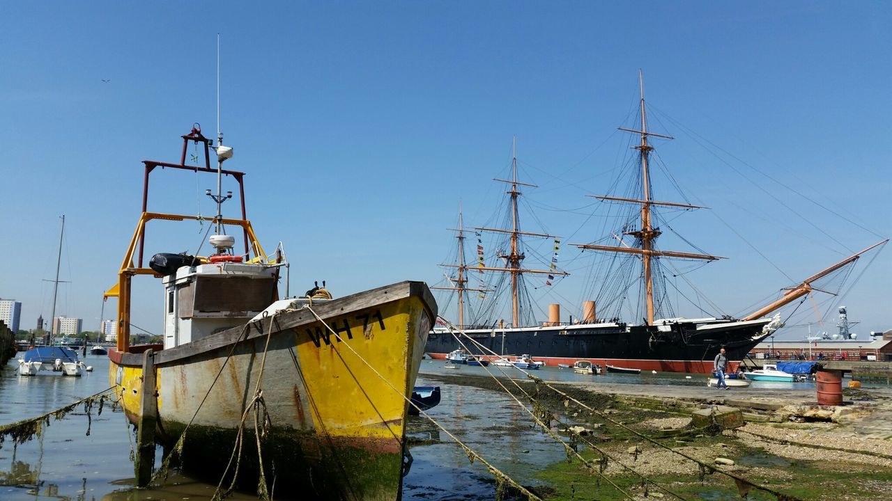 Low angle view of nautical vessels in harbor